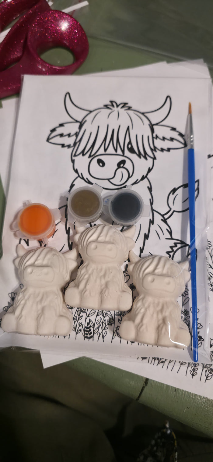 Highland Cow plaster paint kit with paints, brush, and coloring sheet